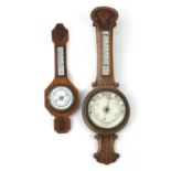 Two oak aneroid wall barometers with thermometers, the largest 89cm high :For Further Condition