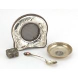 Silver items comprising a miniature silver easel photo frame, pin dish, souvenir teaspoon and silver