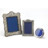 Two silver easel photo frames and silver plated photo frame, the largest 28cm high :For Further