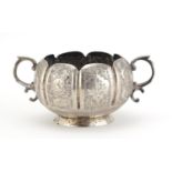 Indian silver twin handled sugar bowl embossed with birds amongst foliage, indistinct impressed