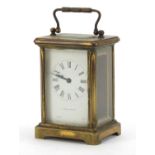 Brass cased carriage clock retailed by Rowell of Oxford with enamel dial and Roman numerals, 11.