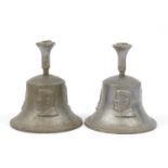 Pair of British military World War II die cast bells, made from a German aircraft destroyed over