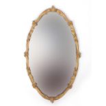 Ornate oval gilt framed mirror, 72cm x 42cm :For Further Condition Reports Please Visit Our Website,