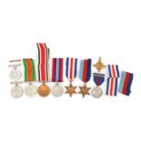 Eight mostly British military and police medals and a King Geroge V and Queen Mary coronation medal,