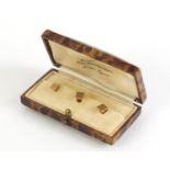 Set of three 9ct gold gentleman's studs, 2.8g, housed in a tooled leather fitted case :For Further