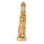 Japanese carved ivory Okimono of a Geisha girl holding flowers, 21.5cm high :For Further Condition