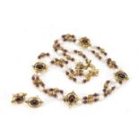 Gilt metal, garnet and fresh water pearl necklace with matching earrings, the necklace 35cm in