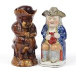 Two Antique Staffordshire Toby jugs including a treacle glazed example, the largest 25cm high :For
