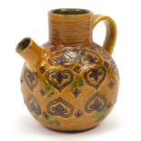 Italian pottery ewer with incised stylised motifs, inscribed to the base, 18.5cm high :For Further