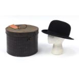 Military interest bowler's hat and tin case with applied Edward Smith plaque, the case inscribed H A