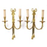 Pair of Louis XVI style two branch brass wall sconces of bow and tassle design, 38cm high :For