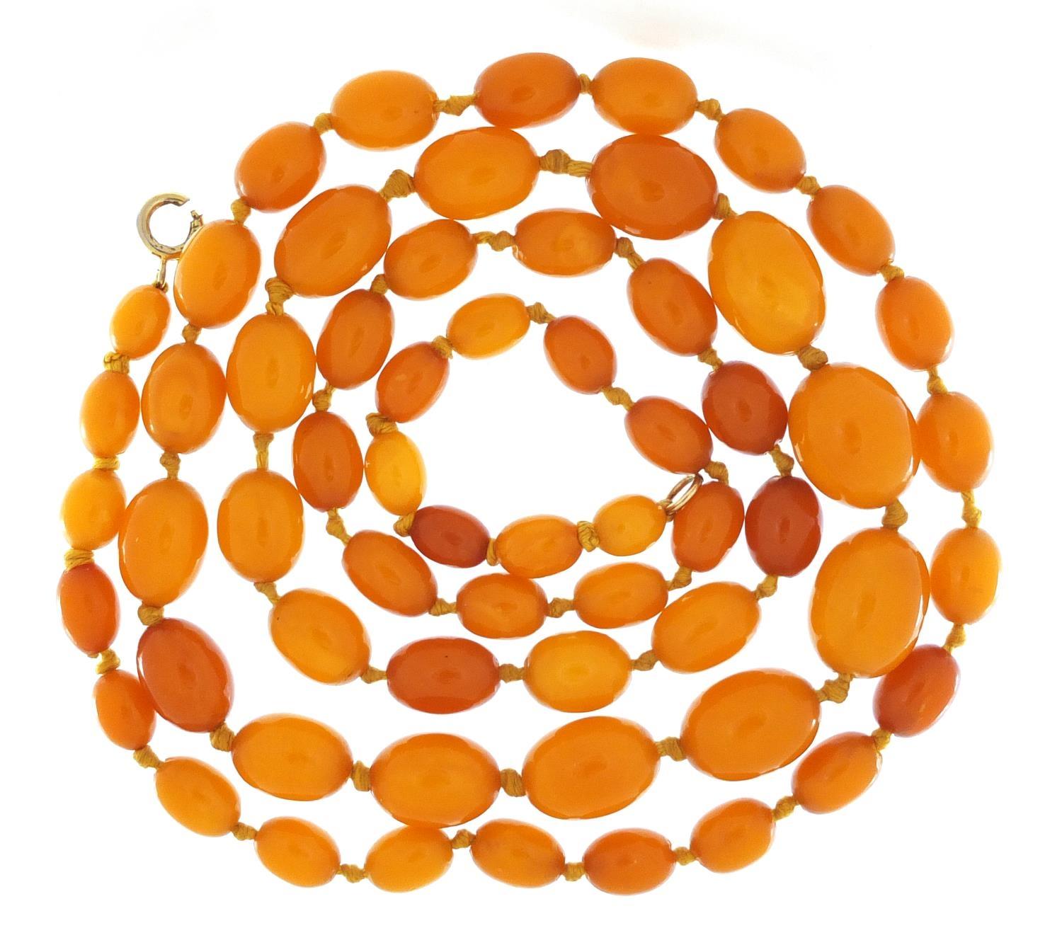 Butterscotch amber coloured bead necklace, 100cm in length, 49.8g :For Further Condition Reports - Image 2 of 5