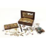 Costume jewellery including brooches, necklaces, rings and earrings housed in a wooden jewellery box