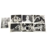 Vintage black and white movie stills, including Walt Disney and Alice in Wonderland, each