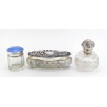 Three Victorian and later cut glass jars with silver lids, one with blue guilloche enamel, various