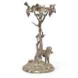 Silver plated centrepiece in the form of a dog beside a tree trunk, 31.5cm high :For Further