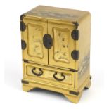 Good Japanese gold lacquer table cabinet fitted with an arrangement of drawers, finely gilded with