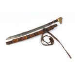 Indonesian parang ilang knife with wooden scabbard, horn handle and engraved steel blade, 76.5cm