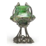 Art Nouveau pewter stand housing an iridescent green glass vase in the style of Loetz, 25cm high :