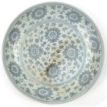 Large Chinese blue and white porcelain charger, hand painted with stylised flower heads amongst