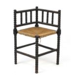 Antique bobbin turned corner chair with rush seat, 68cm high :For Further Condition Reports Please