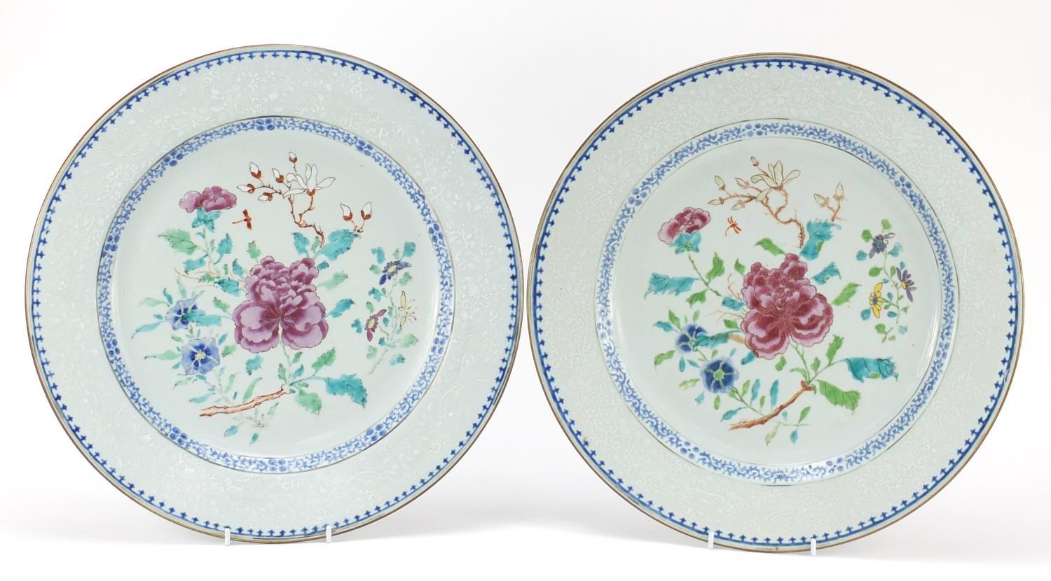 Good pair of Chinese porcelain chargers, each finely hand painted in the famille rose palette with