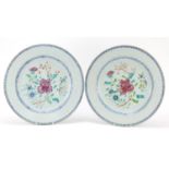 Good pair of Chinese porcelain chargers, each finely hand painted in the famille rose palette with