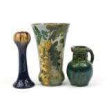 Two art pottery vases and a puzzle jug, the largest 23.5cm high :For Further Condition Reports