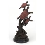 Patinated bronze sculpture of three sea turtles, raised on a circular marble base, 41cm high :For