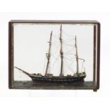Wooden model of a rigged sailing ship, housed in a mahogany and glass display case, 42cm in