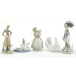 Lladro and Nao including a girl holding a parasol with geese and a girl holding a goat, the