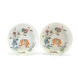 Pair of Chinese porcelain dishes, each finely hand painted in the famille rose palette with an