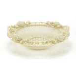 Irish porcelain floral encrusted basket with twin handles by Beleek, 22.5cm in diameter :For Further