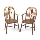 Pair of antique wheel back elbow chairs with elm seats, 98cm high :For Further Condition Reports