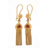 Pair of continental gold tassel earrings, set with red stones, each stamped 84VA, 5cm in length, 5.