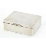 Naval interest silver cigarette box with engine turned decoration, the hinged lid engraved CDR.P.T.