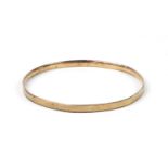 Large 9ct gold metal core bangle with engine turned decoration, 9cm in diameter, 20.4g :For