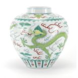 Chinese porcelain Wucai vase, hand painted with two dragons chasing the flaming pearl amongst clouds