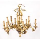 Good Rococo style gilt brass/bronze twelve branch chandelier, 64cm in diameter x 65cm high :For