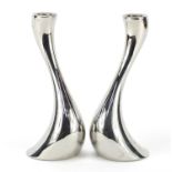 Pair of modernist Georg Jensen candle holders, each 20cm high :For Further Condition Reports