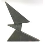 1970's carved black slate three piece sculpture by Victor Anton, 61cm high (PROVENANCE: Given