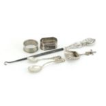 Silver items including Dutch caddy spoon, napkin rings and teaspoons, various hallmarks, the largest