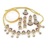 Indian gilt metal costume jewellery comprising two pendants, a pair of drop earrings, a necklace and