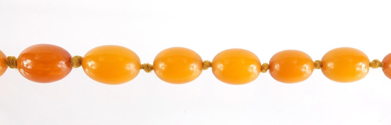 Butterscotch amber coloured bead necklace, 100cm in length, 49.8g :For Further Condition Reports - Image 4 of 5