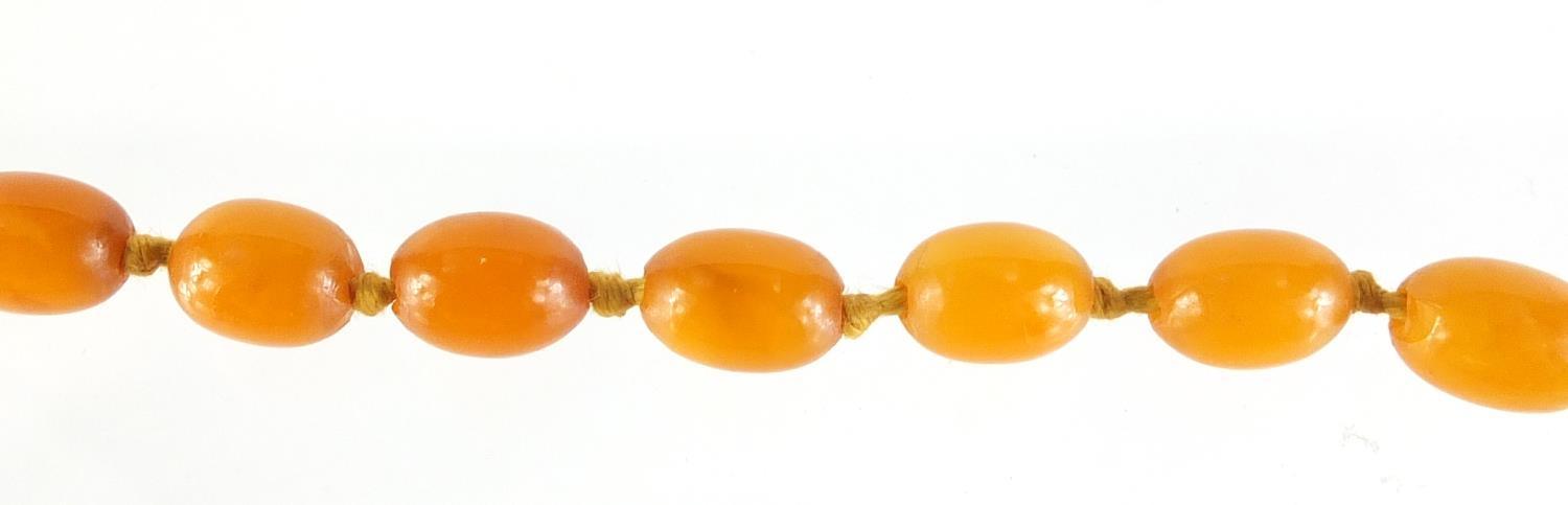 Butterscotch amber coloured bead necklace, 100cm in length, 49.8g :For Further Condition Reports - Image 5 of 5
