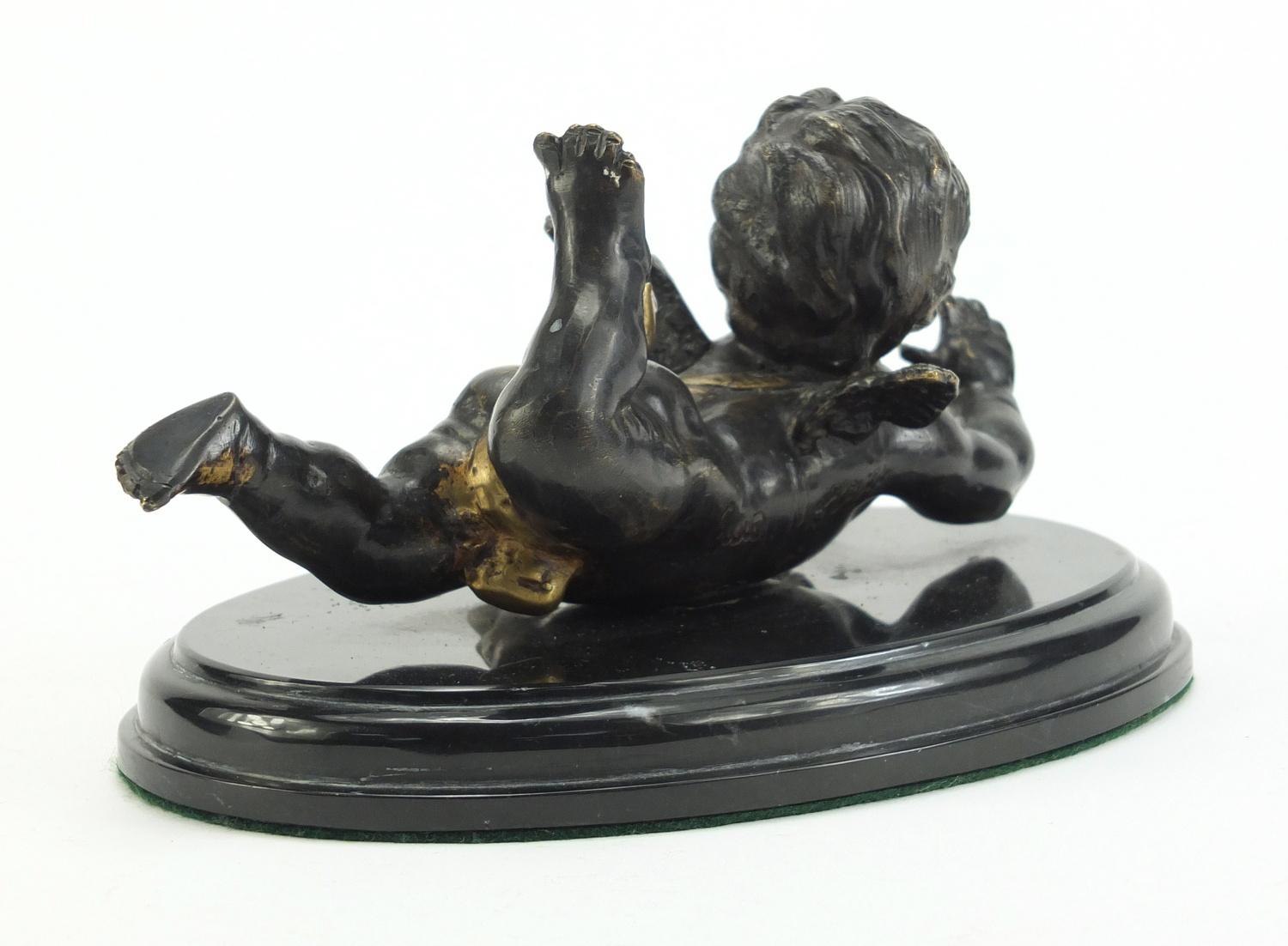 Classical patinated bronze figure of Putti raised on an oval marble base, 18.5cm wide :For Further - Image 2 of 3