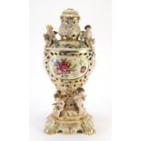 Copodimonte reticulated urn lamp base decorated with Putti, 45.5cm high :For Further Condition