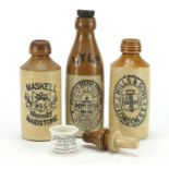 Three antique stoneware bottles and an ointment jar, the largest 22cm high :For Further Condition