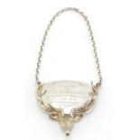 Large silver stags head decanter label with presentation inscription, London 1989, 6cm in length,