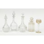 Glassware including a Continental etched and hand gilded glass and four decanters with stoppers :For